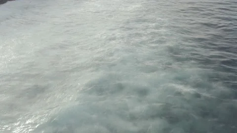 Aerial view. Waves reaching beach. Lots of bubbles. Drone shot. Stock Footage 158891282