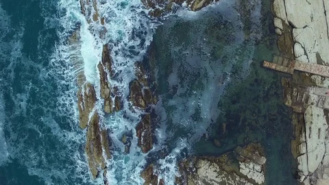 Aerial view of waves on the rocks Stock Footage 116107945