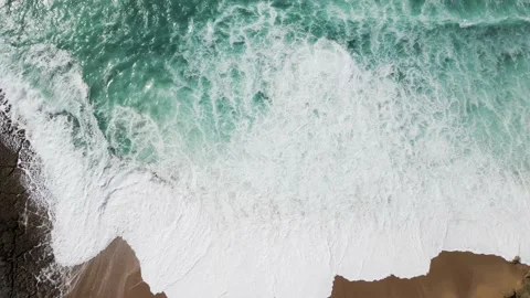 Aerial view of waves rolling on the beach, Setubal, Portugal. Stock Footage 152746476