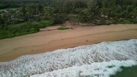 Aerial View of Waves Rolling Onto Sandy Anahola Beach, Kauai Hawaii Видео 348421311