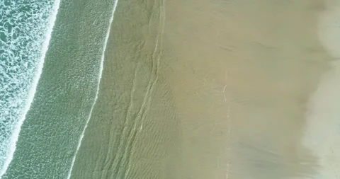Aerial View of Waves Rolling onto a Wet Sandy Beach, Coastal Texture. 스톡 동영상 323626529