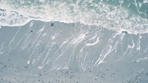 Aerial view waves on sand beach Stock Footage 107864775