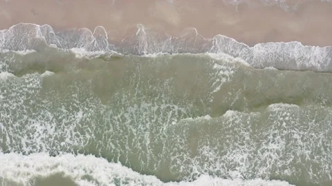 Aerial view of waves on a sandy tropical beach. Stock Footage 155997914