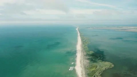 Aerial view of waves on a sandy tropical beach. Stock Footage 158436742