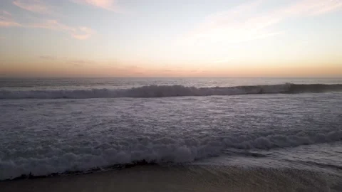 Aerial view of the waves at sunset Stock Footage 157454392