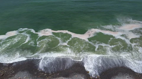 Aerial view of the waves when reaching the shore Stock Footage 151614636
