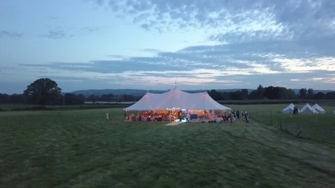 Aerial view. Wedding reception ceremony setup with big white tents and people Stock Footage 123798916