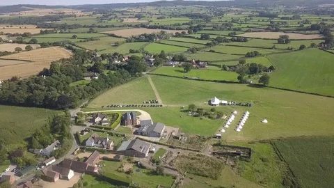 Aerial view. Wedding reception ceremony setup with big white tents and people Video stock 123798957