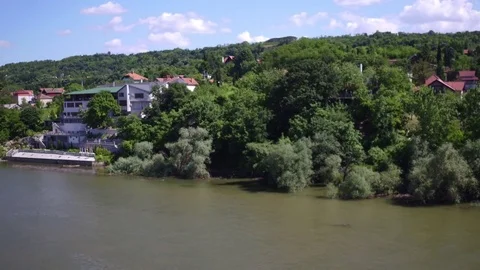 Aerial view from weekend resort with forest trees by the river, drone shot. 스톡 동영상 85086291