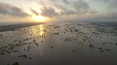 Aerial view of wetlands under cloudy sky at golden hour, Mexico. Stock Footage 284848308