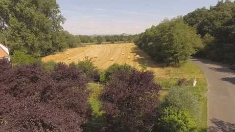 Aerial View Wheat Field After Harvest with Hay Bales Stock Footage 101302392