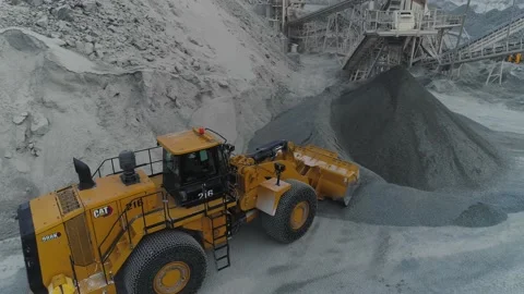 Aerial view of Wheel Loader loads rubble into the truck Stock Footage 216947083