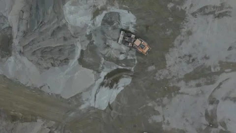Aerial view of a wheel loader moving sand in a quarry Stock Footage 343844892