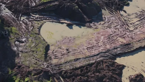 Aerial view of wheel loader pushing landfill waste Stock Footage 341266201