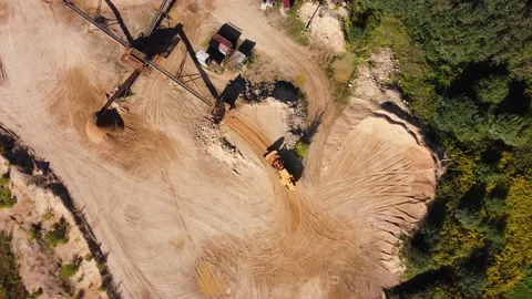 Aerial view at wheel loader transports sand in a sand quarry Stock Footage 163376299