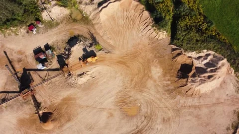Aerial view at wheel loader transports sand in a sand quarry Stock Footage 163376443