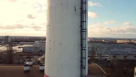 Aerial view while going up on a pipe Throwing Smoke in the Sky Stock-Footage 125677621