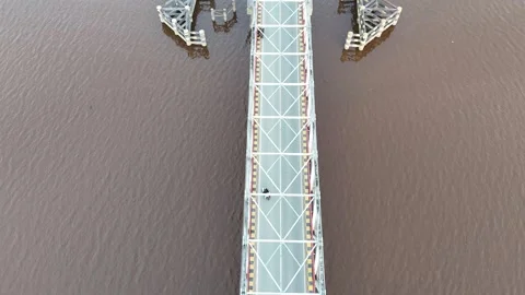 Aerial view of white bridge spanning river Stock Footage 327214040