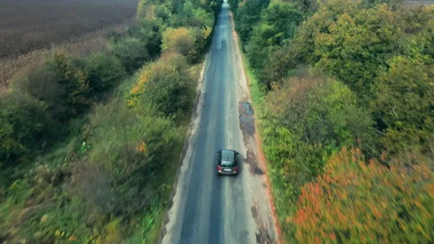 Aerial View Of White Car Driving On Country Road Stock Footage 146047341