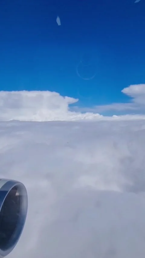 Aerial view of white cloud layer and blue sky seen from passenger airplane durin Stock Footage 330174817