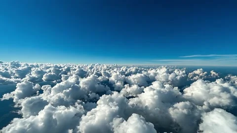 Aerial View of White Clouds Above a Vibrant Blue Sky Stock Footage 304444535