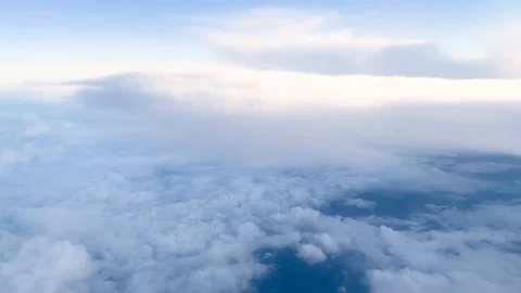 Aerial view of white clouds and sky from plane window Stock-Footage 121354765