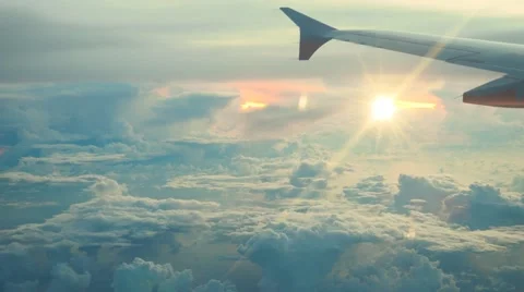 Aerial view of  white clouds on blue sky on sunrise with reflection in ocean Stock-Footage 65004812