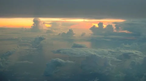 Aerial view of  white clouds on blue sky on sunrise with reflection in ocean Stock-Footage 65005131