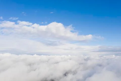 Aerial view white clouds in blue sky. View from drone. Aerial top view clouds Stock Photos