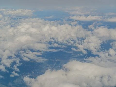 Aerial view of white clouds over blue sky and land 写真素材