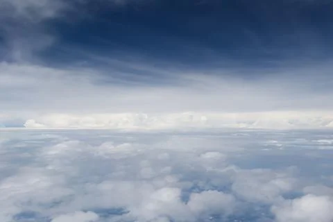 Aerial View of White Clouds Under a Dark Blue Sky Stock Photos