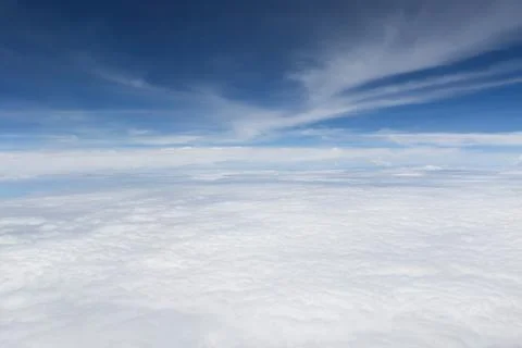 Aerial View of White Clouds Under a Blue Sky with Wispy Clouds Stock Photos