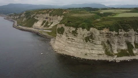Aerial view of the white columnar joint cape and coastline. Video stock 160402905