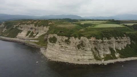 Aerial view of the white columnar joint cape and coastline. Video stock 160403078