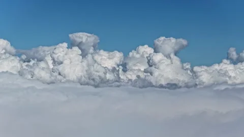 Aerial view of white fluffy clouds creating a heavenly calm scene Vídeos de archivo 318078861