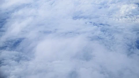 Aerial View Of White Fluffy Clouds Floating Over The Blue Sky Above Earth Stock Footage 342100651