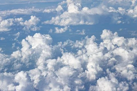 Aerial view of white fluffy clouds in blue sky Stock Photos