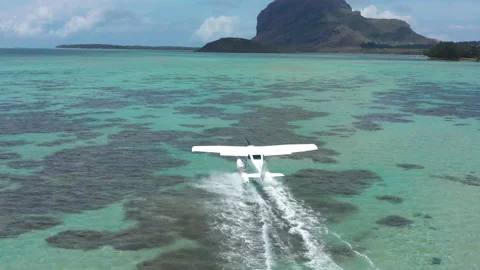 Aerial view. White hydroplane takeoff in a calm lagoon Stock Footage 167700939