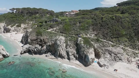 Aerial View of White Pebble Beach and Turquoise Sea – 4K Coastal Drone Footage Stock Footage 310180537