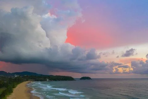 Aerial view white rain cloud in pink sky at sunset Stock-Fotos
