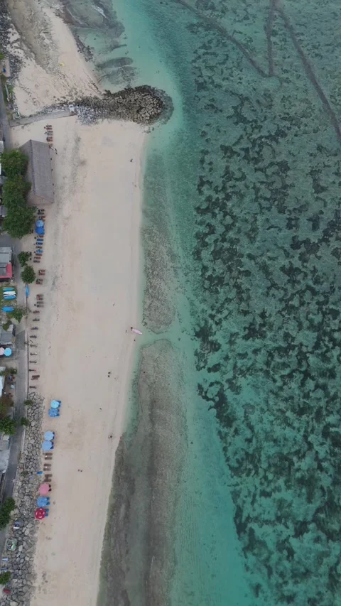 Aerial View of a White Sand Beach with Turquoise Reef Water, East Bali Video stock 337310237
