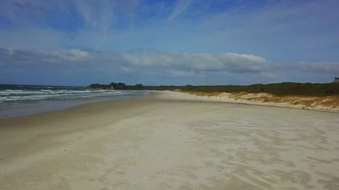 Aerial view of white sandy beach of Rarawa New Zealand 4K Stock Footage 91812347