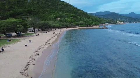 Aerial view of white sandy beach with tourists, blue sea water Stock-Footage 277861197