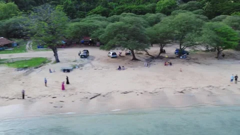 Aerial view of white sandy beach with tourists, blue sea water Stock Footage 277861201