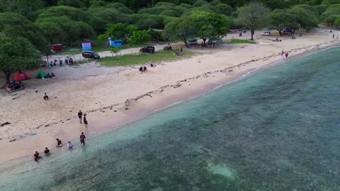 Aerial view of white sandy beach with tourists, blue sea water Stock-Footage 277861246