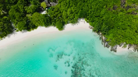 Aerial view of white sandy beach with turquoise waters. Seychelles. Stock Footage 301356637