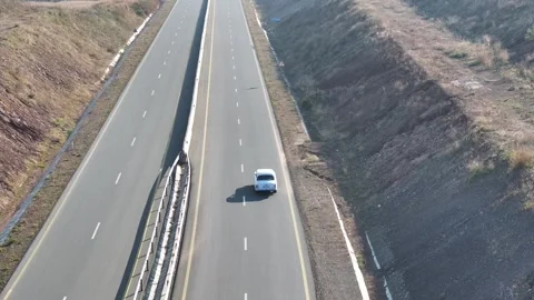 Aerial View of a White Van Drive on a Multi-Lane Highway in the Country Stock Footage 341979938