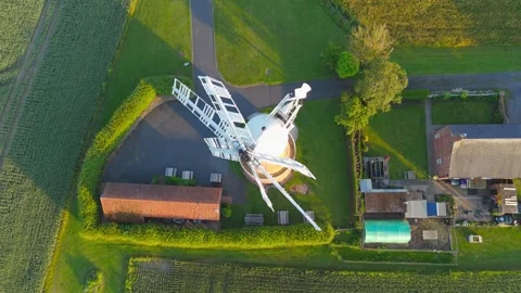 Aerial view of a white windmill in a green countryside Stockbeeldmateriaal 342614997
