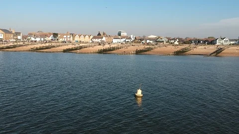 Aerial view of Whitstable beach from inside the ocean Stock Footage 107480593