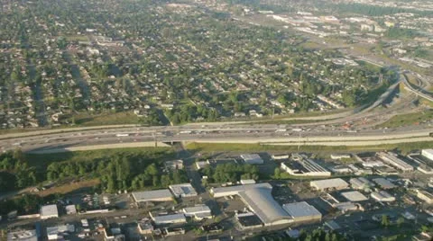 Aerial View of Wide Interstate Bend on Sunny, Summer Day Stock Footage 11344127